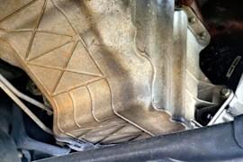 Where Is the Oil Pan Located In a Car?
