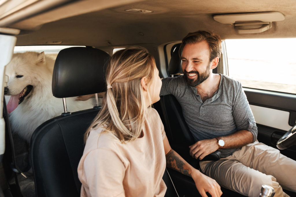 couple on date in car with dog