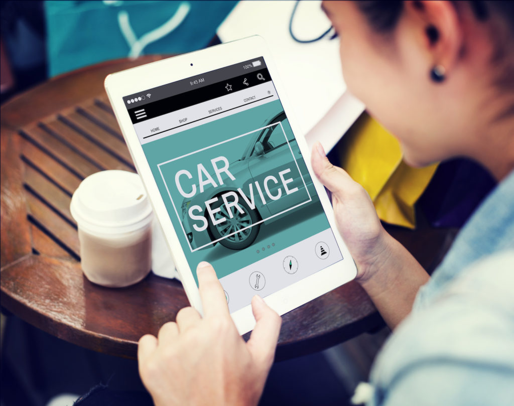 woman reading online car service manual