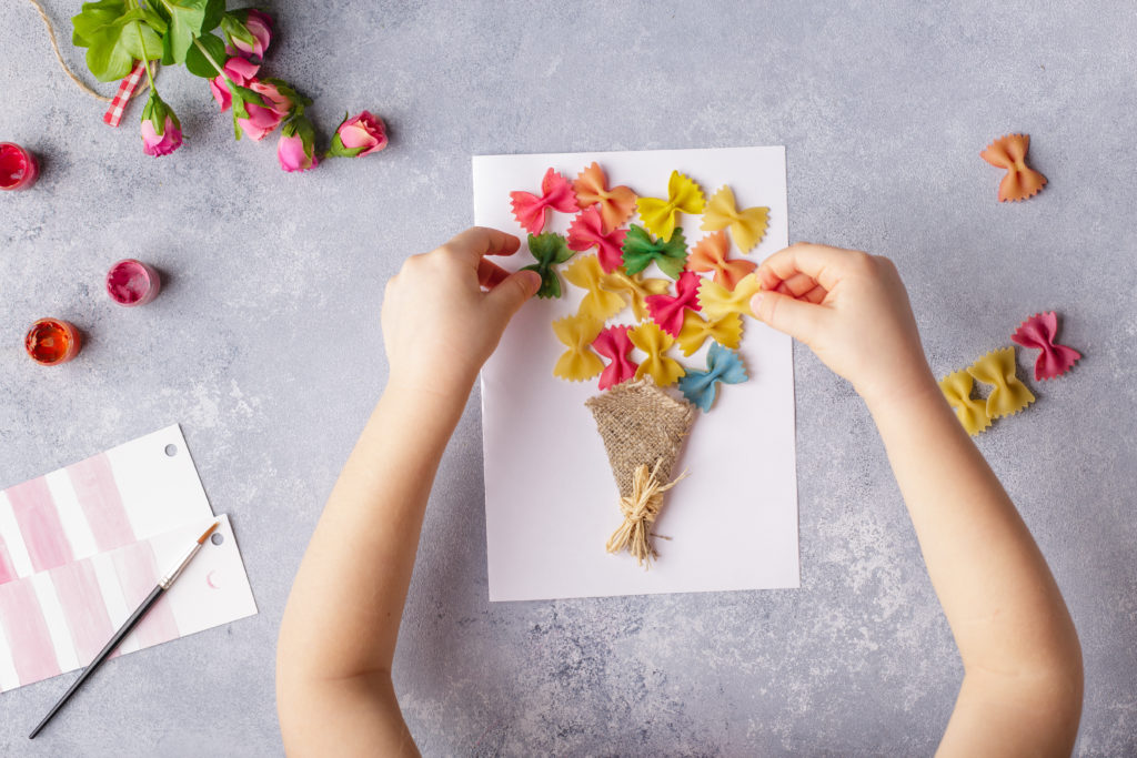 Child doing arts and crafts for Mother's Day