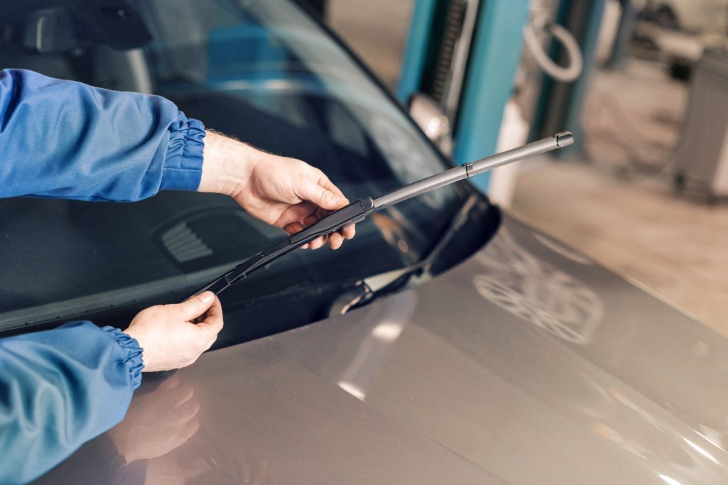 Mechanic fixing broken windshield wiper arm