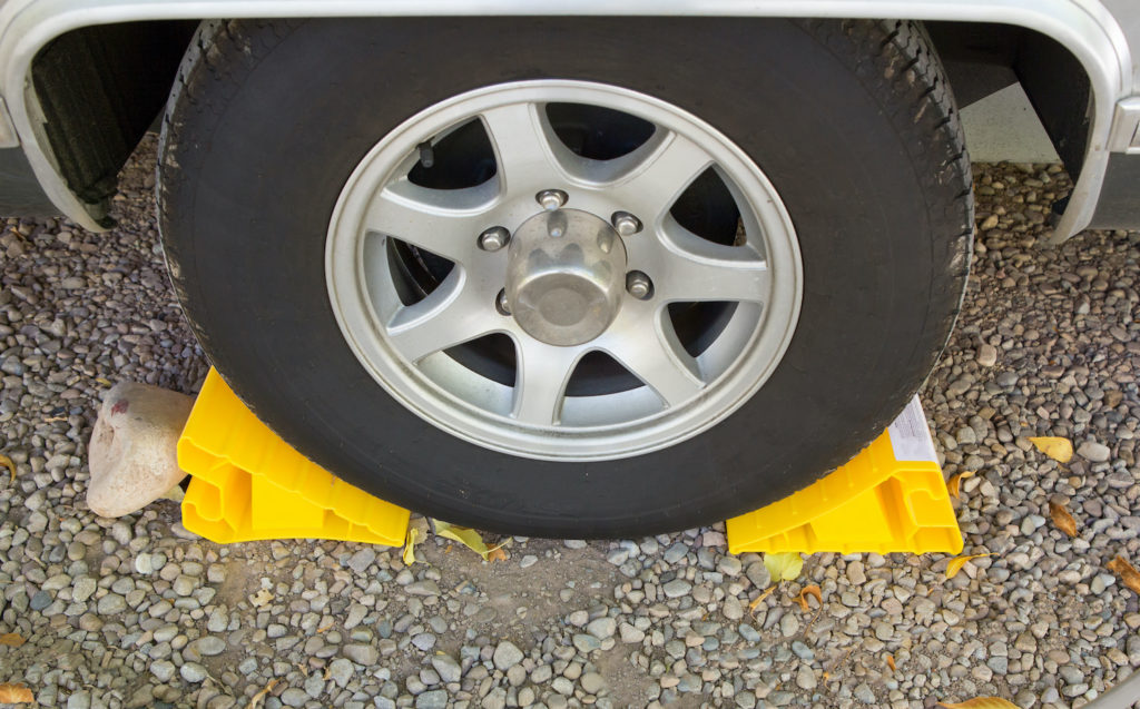car wheel with two yellow wheel stoppers