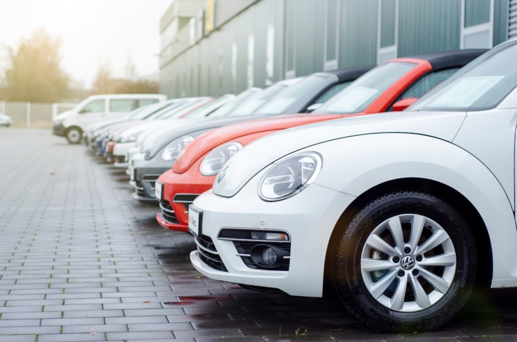 Modern Volkswagen Beetles in parking lot