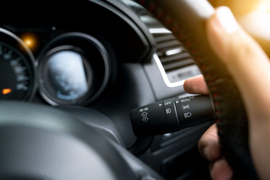 Hand on steering wheel