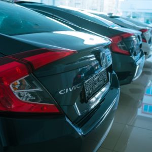 honda civic cars lined up in showroom