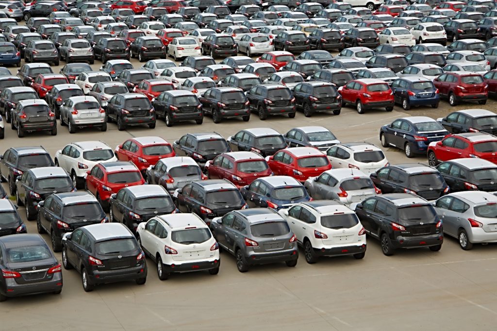 A multitude of Nissan cars in parking lot