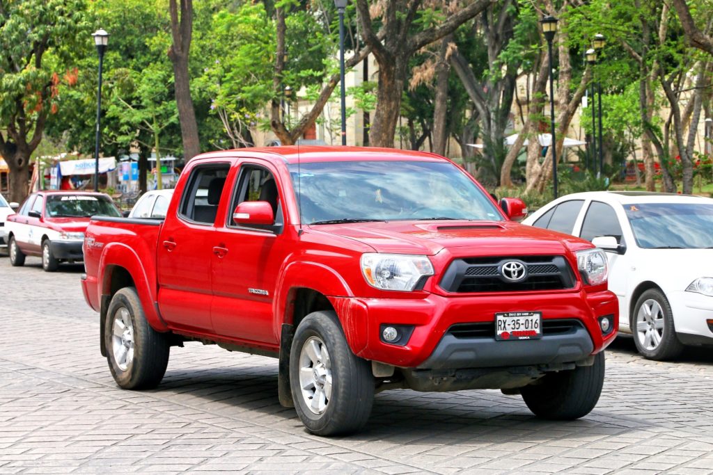 Red Toyota Tacoma in parking lot