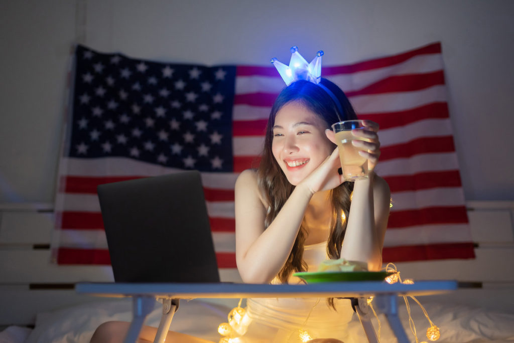 woman on a conference call with american flag decor