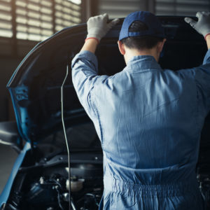 mechanic checking car for maintenance