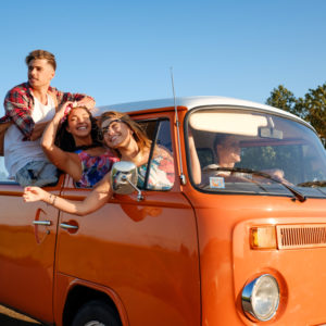 high school friends in van on road trip