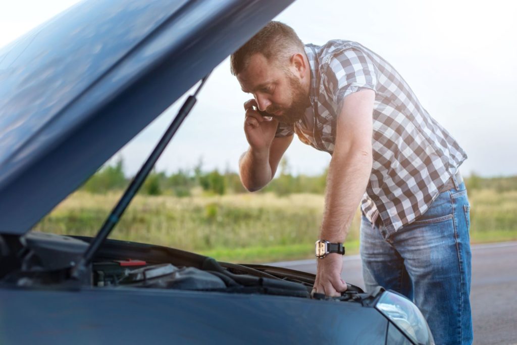 man with car troublesa
