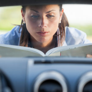 woman reading owners manual