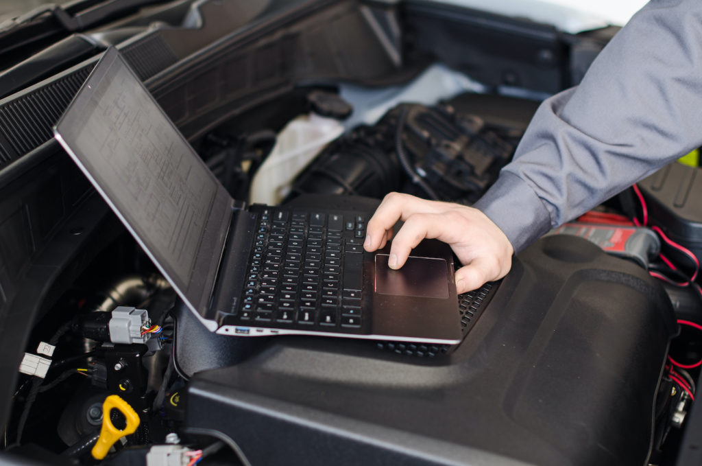 mechanic using a laptop