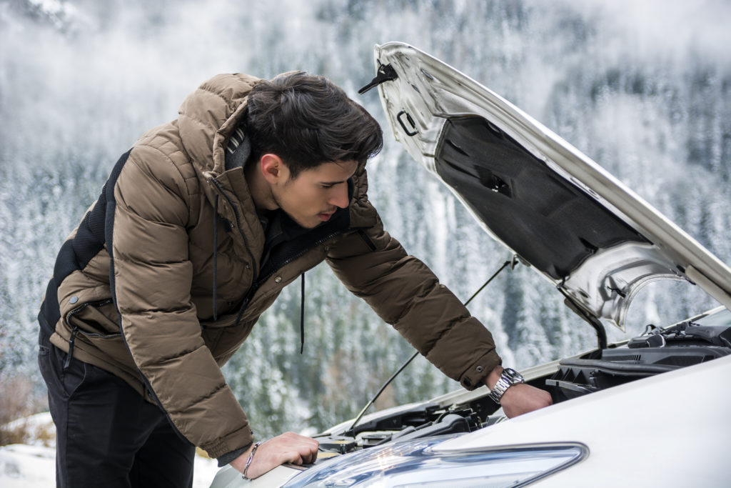 man checking engine