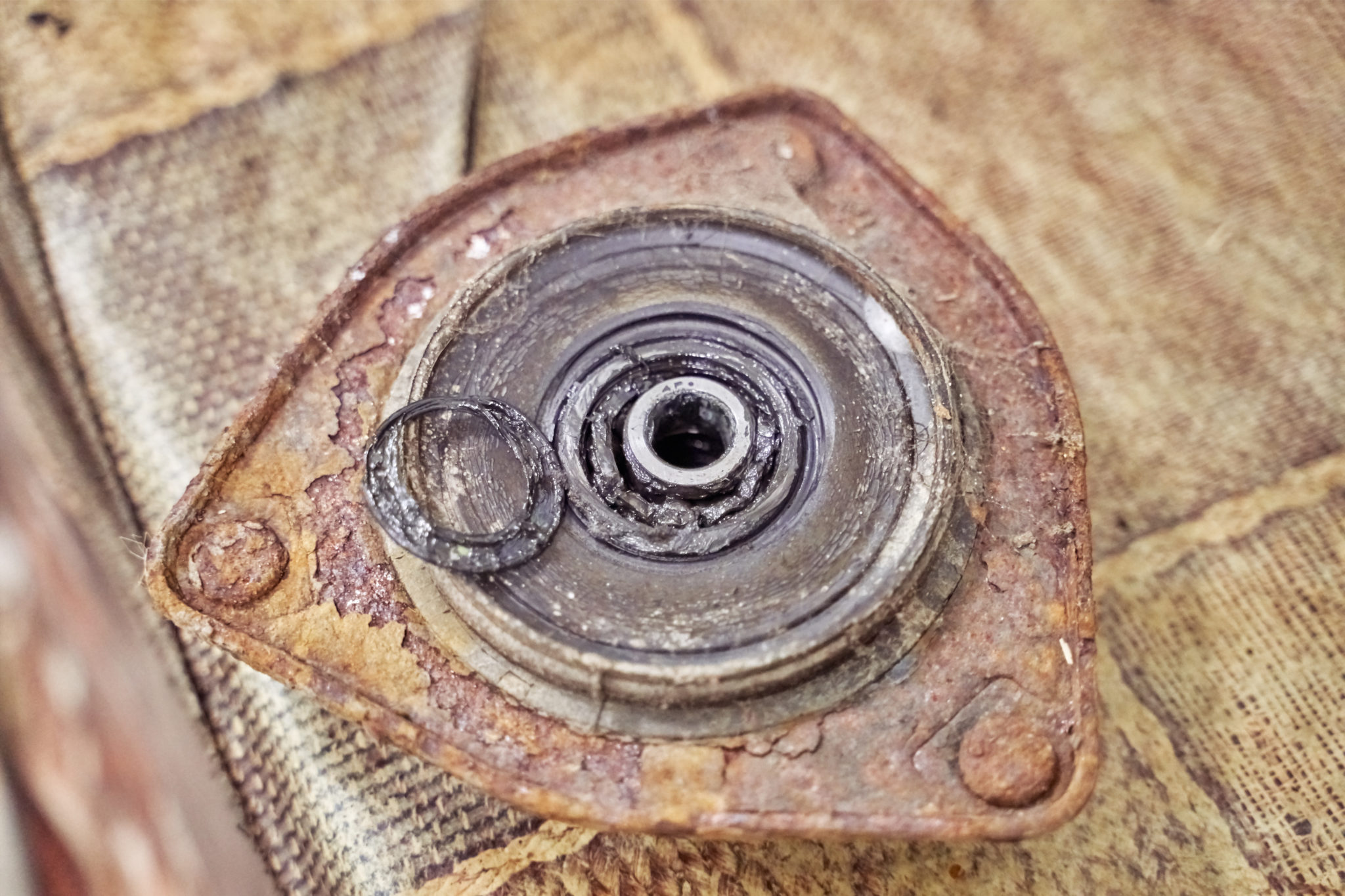 Bad Strut Mount Symptoms In The Garage with