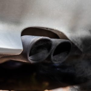 twin tail pipes belching out black smoke