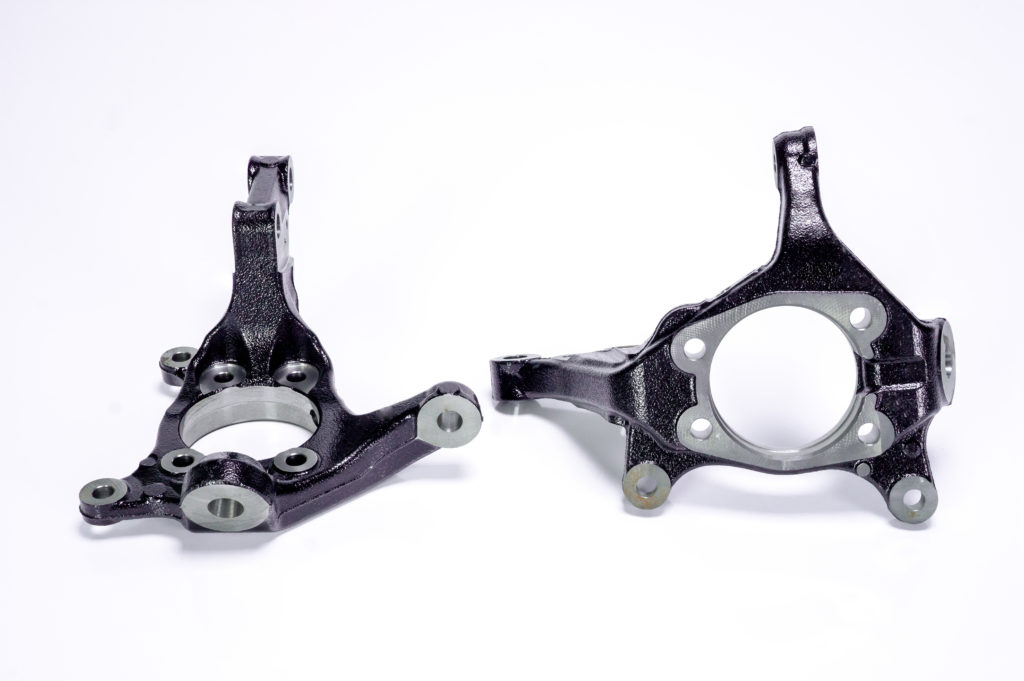 two aftermarket steering knuckles