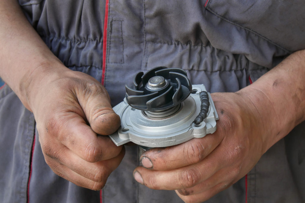 water pump being held