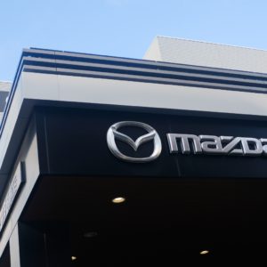 mazda logo on dealership building