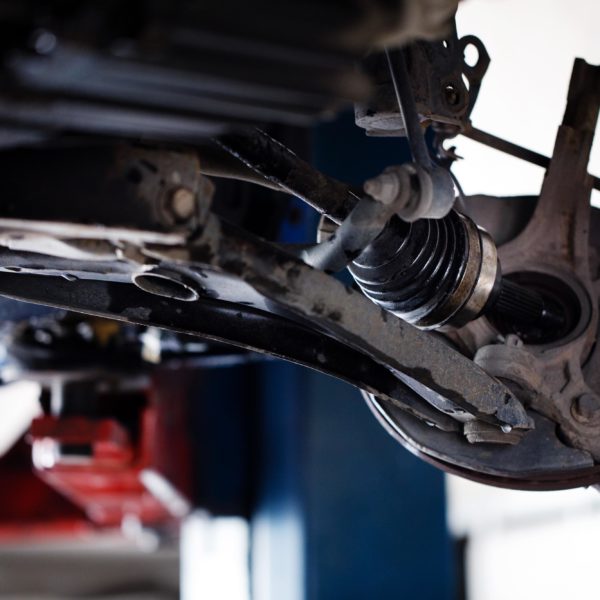 Bad CV Axle Symptoms In The Garage with