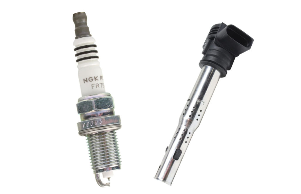 ignition coil and spark plug in white background