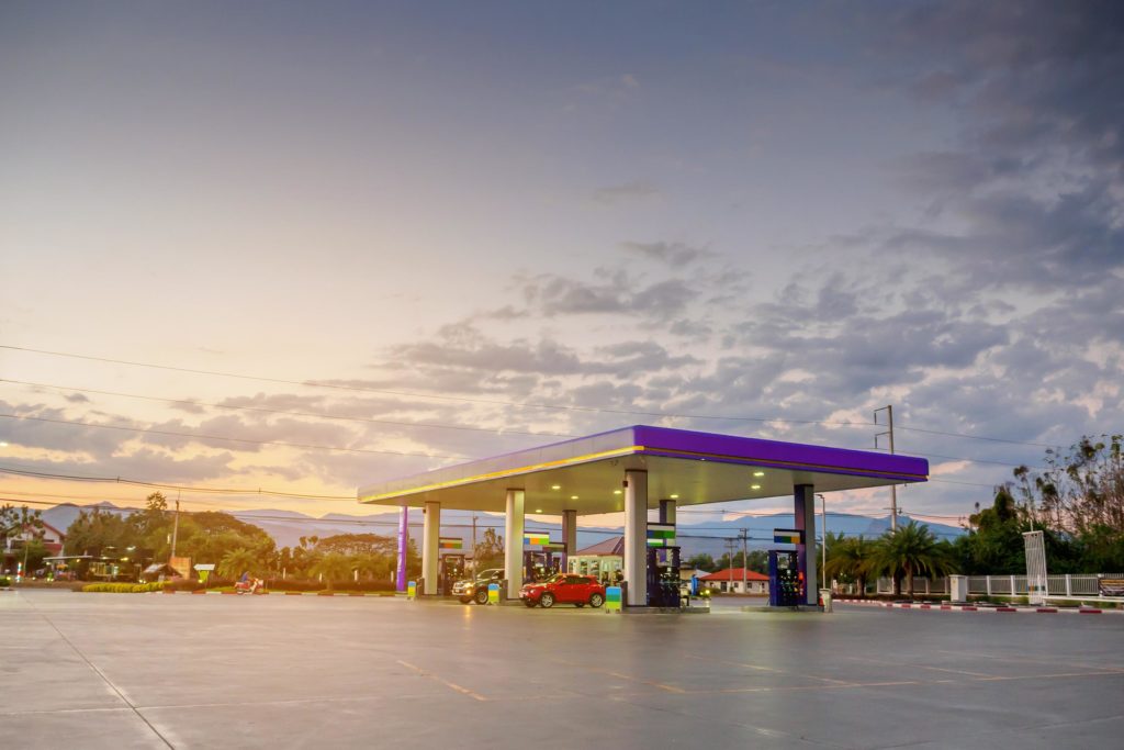 gas station with cloudy sky and sunset