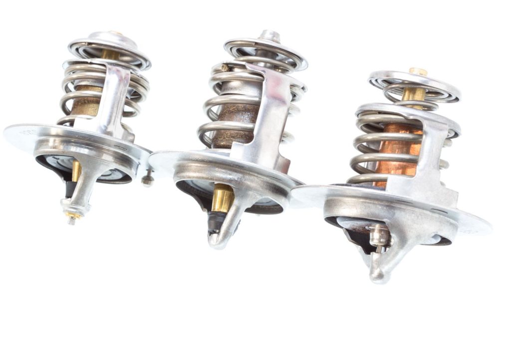 New car thermostat isolated in white