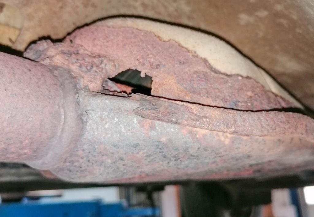 damaged car muffler