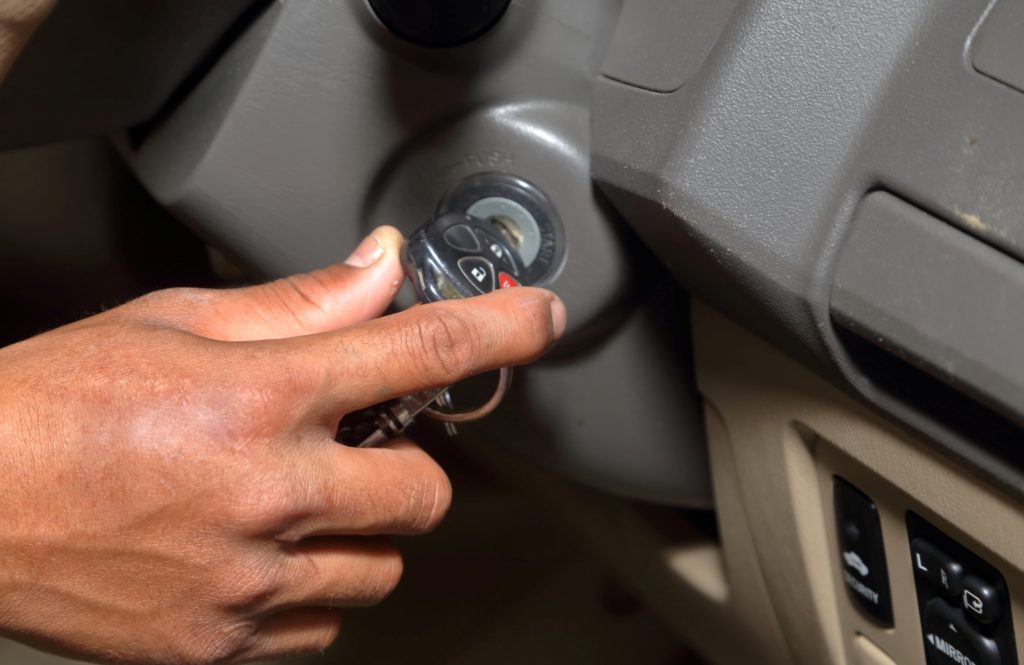 driver starting a car