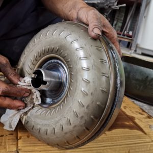 mechanic cleaning torque converter