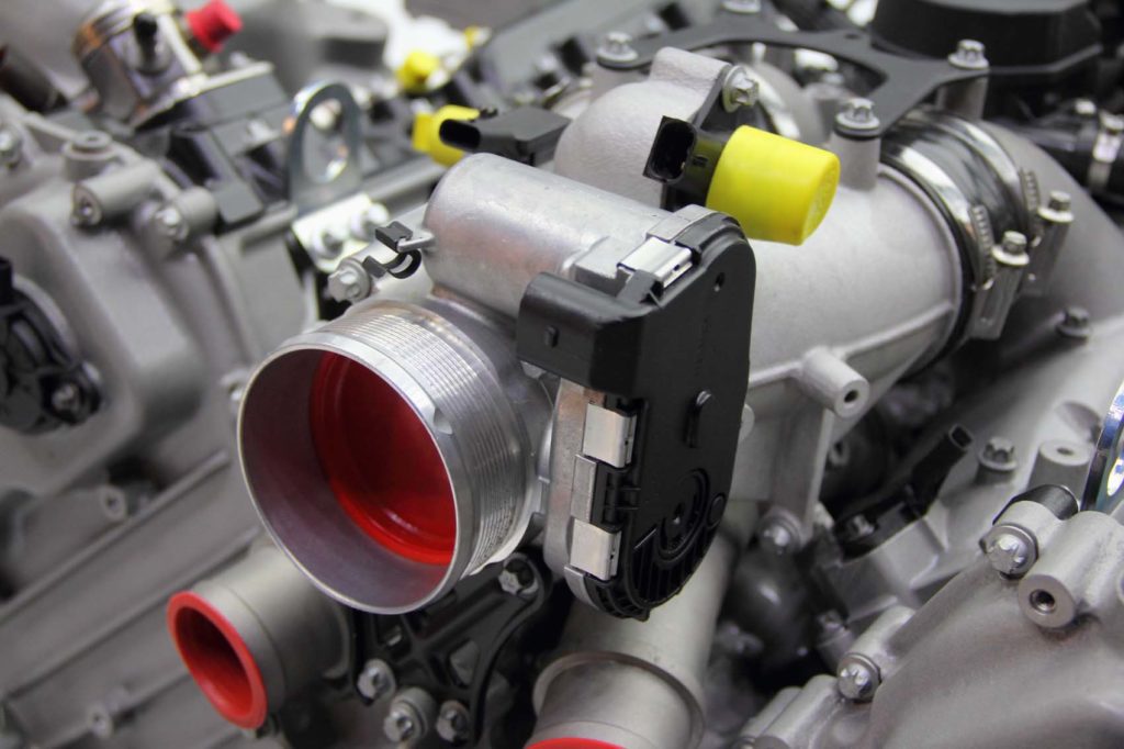 V12 engine with throttle position sensor visible