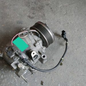 checking air compressor on the ground