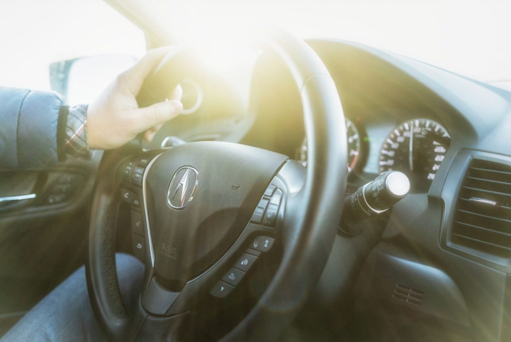 man driving acura rdx