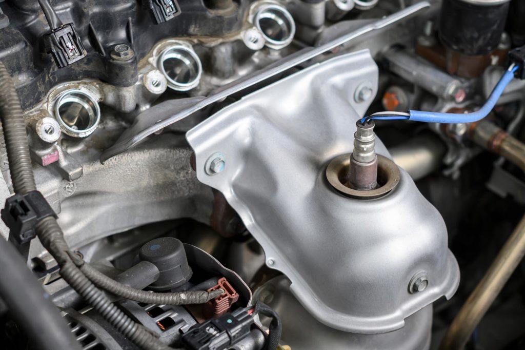 Clear close up view of an Upstream Oxygen Sensor In a Car