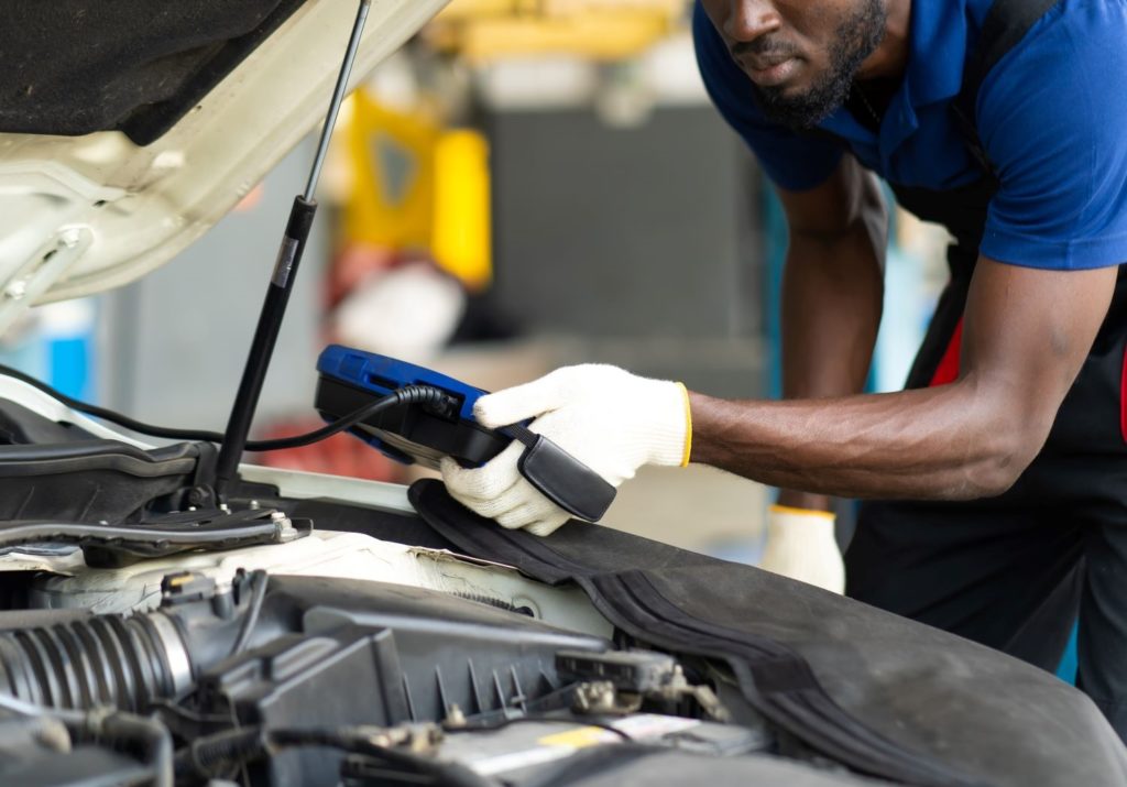 mechanic using obd scanner
