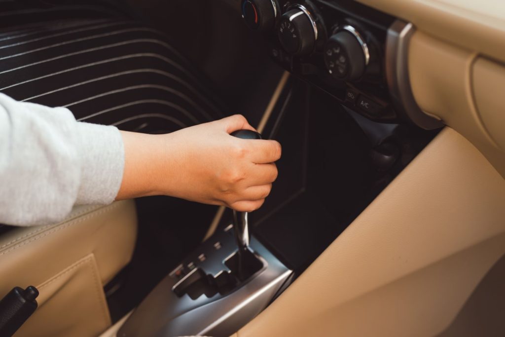 female driver shifting gear