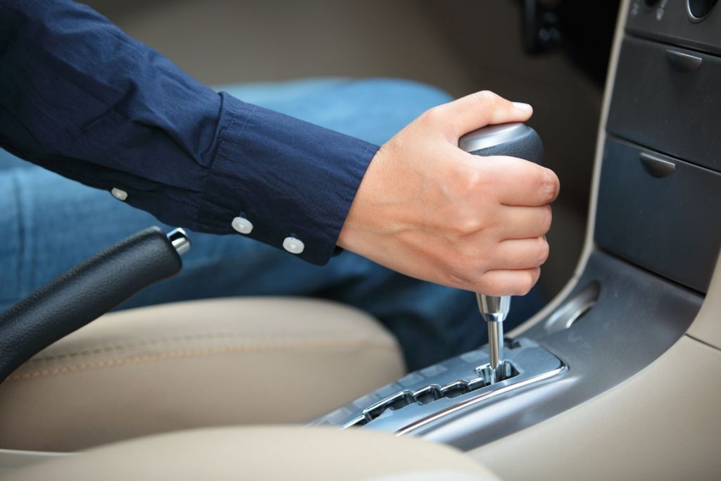 driver holding an automatic transmission gear