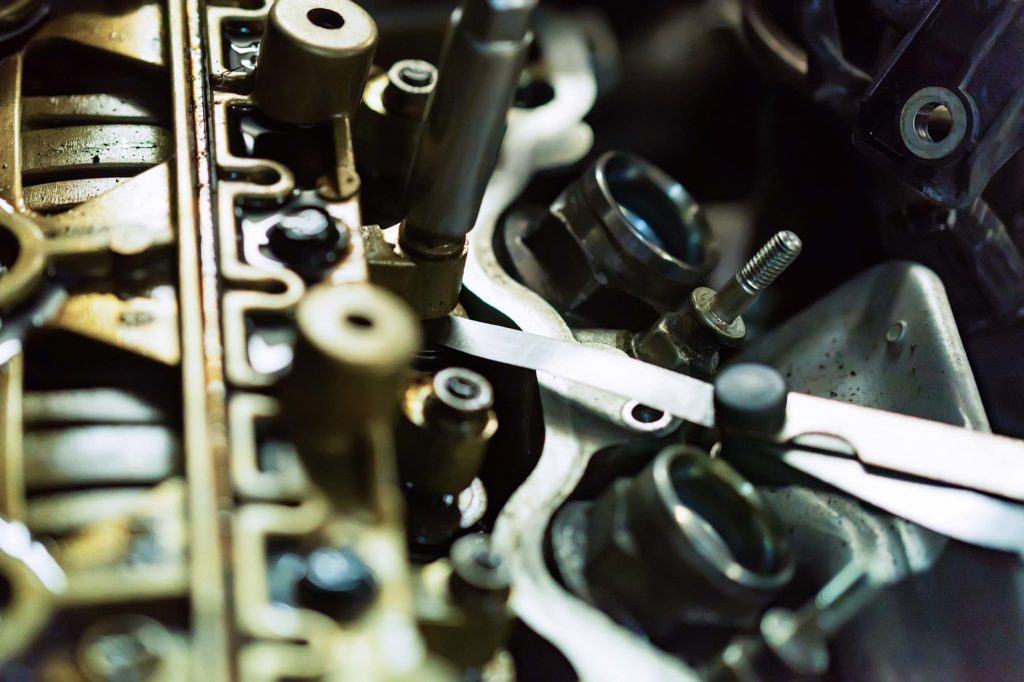 check and adjust valve lash in car engine