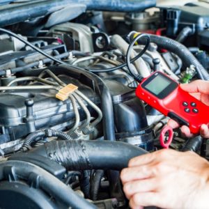 man using an obd scanner tool