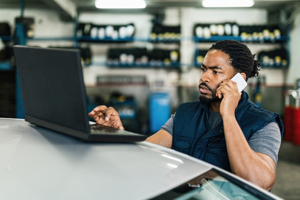 man browsing laptop for obd code solutions
