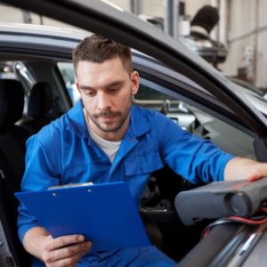 mechanic holding an obd scanner