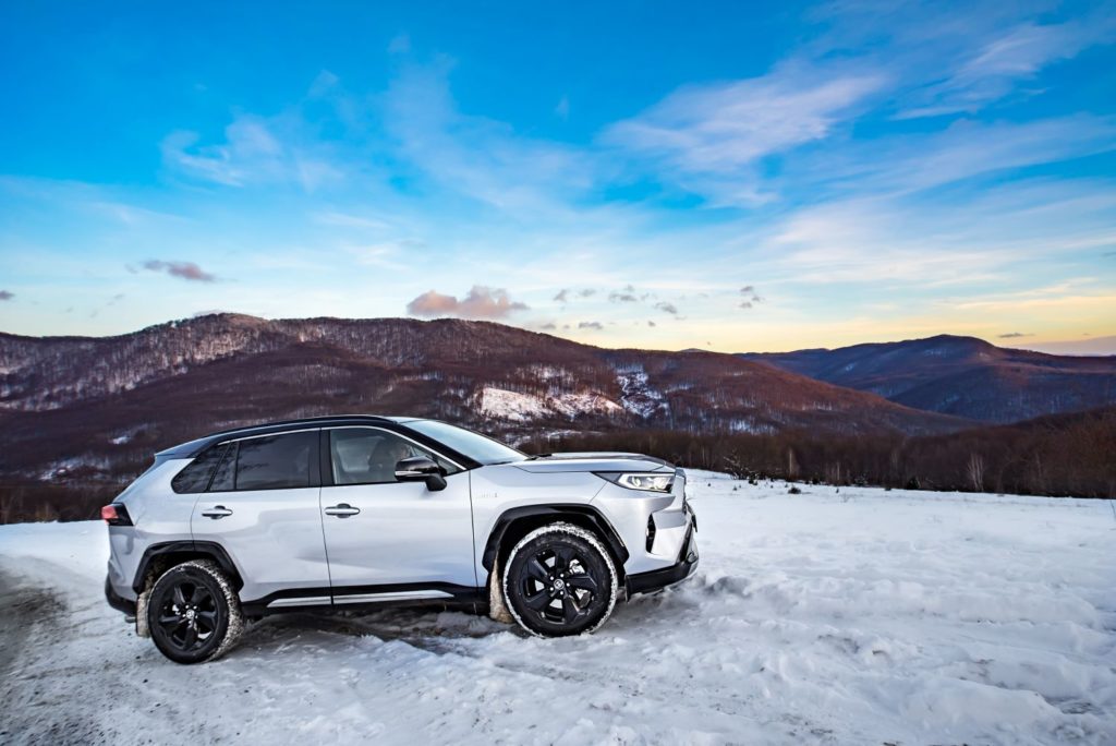 silver suv on a snowy mountain