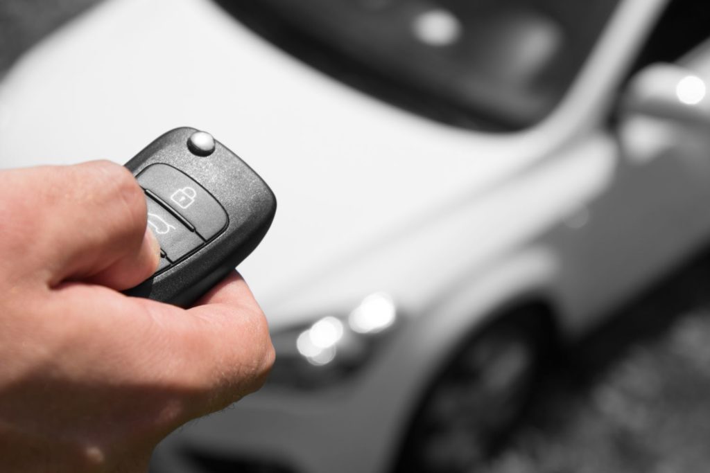 driver holding a key fob
