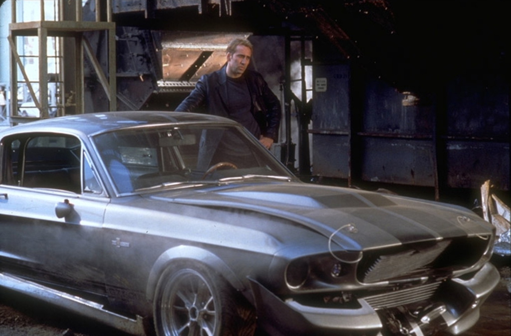 nicholas cage and a ford mustang in a gone in 60 seconds scene