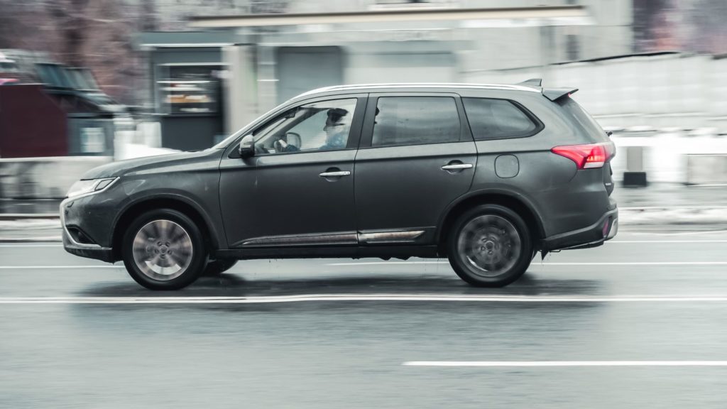 gray suv driving fast