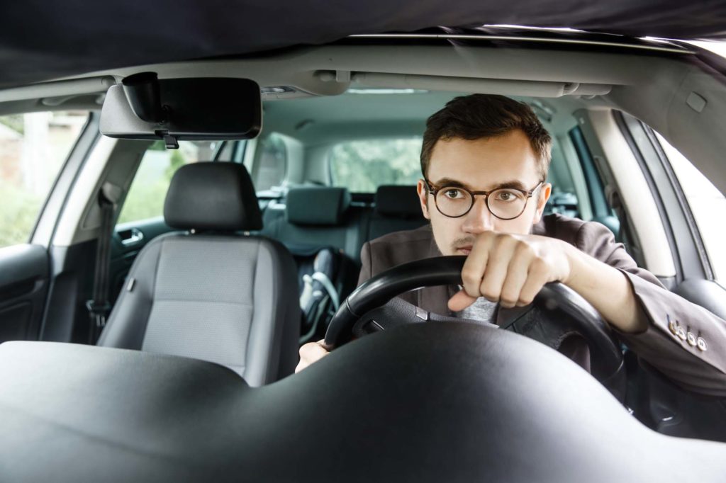 male driver planning to do a left turn