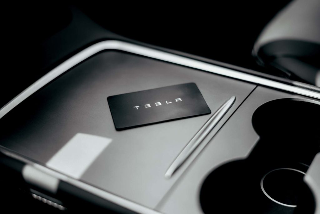 tesla key card placed near cupholder