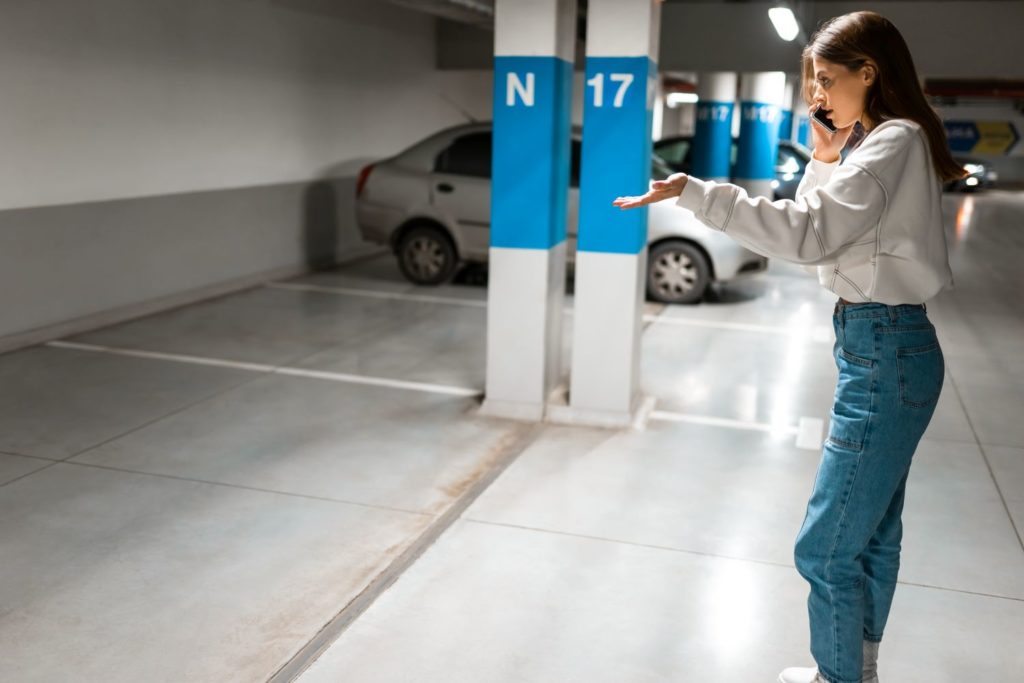 woman calling authorities to report a missing car