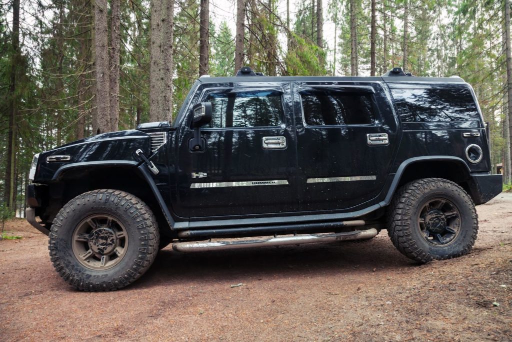 side shot of a black hummer h2