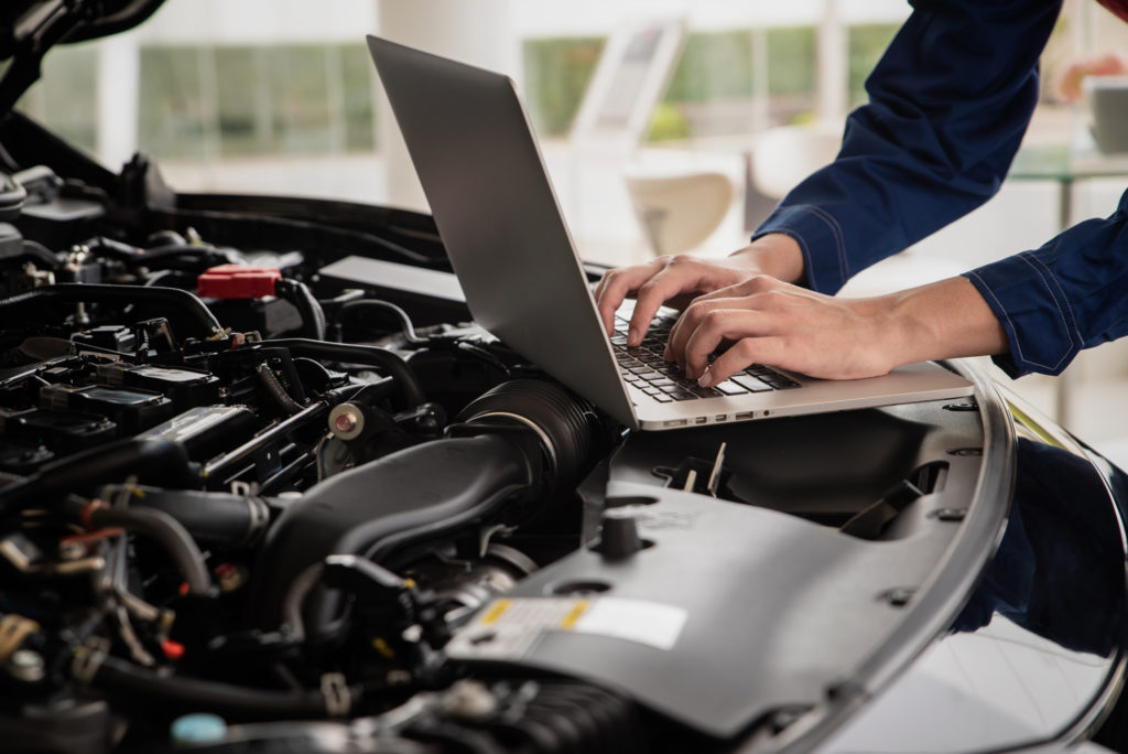 mechanic prepares for car programming
